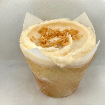 Vanilla cupcake with a Coconut Buttercream topped with Toasted Coconut