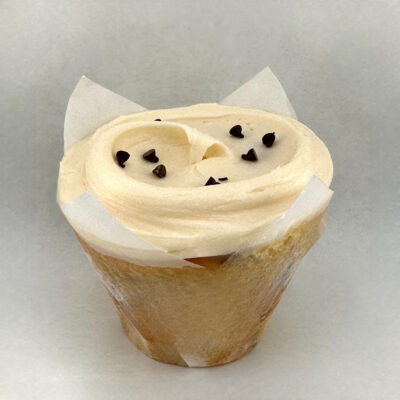 Gluten Free vanilla cake with mini chocolate chips folded into the batter and topped with a vanilla buttercream frosting.