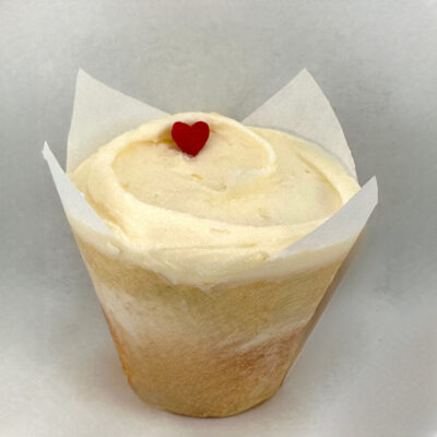Lemon cupcake filled with raspberry jam and topped with a swirl of lemon buttercream.