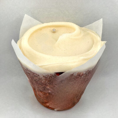 Baked and Wired classic red velvet cupcake with cream cheese frosting and a sliver pearl