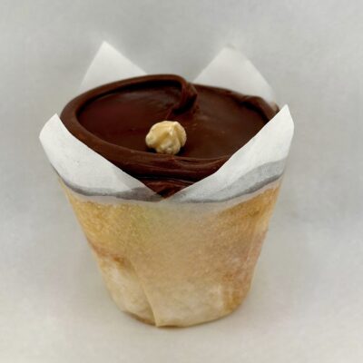 Baked and wired Vanilla cupcake with dulce de leche filling and chocolate-hazelnut satin icing.