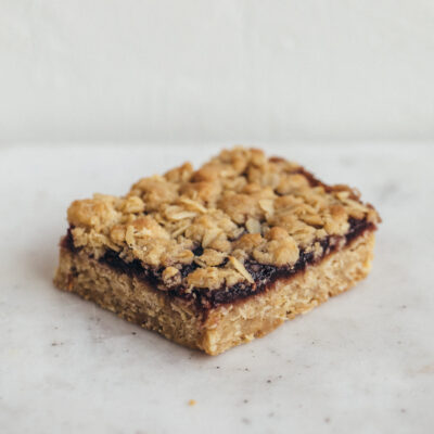 Baked & Wired oatmeal fruit crunch bar with sweet fruit preserves and crunchy oat topping