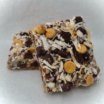 Soccer Mom dessert bar with a graham cracker base layered with coconut, pecans, semi-sweet chocolate chips, and butterscotch.